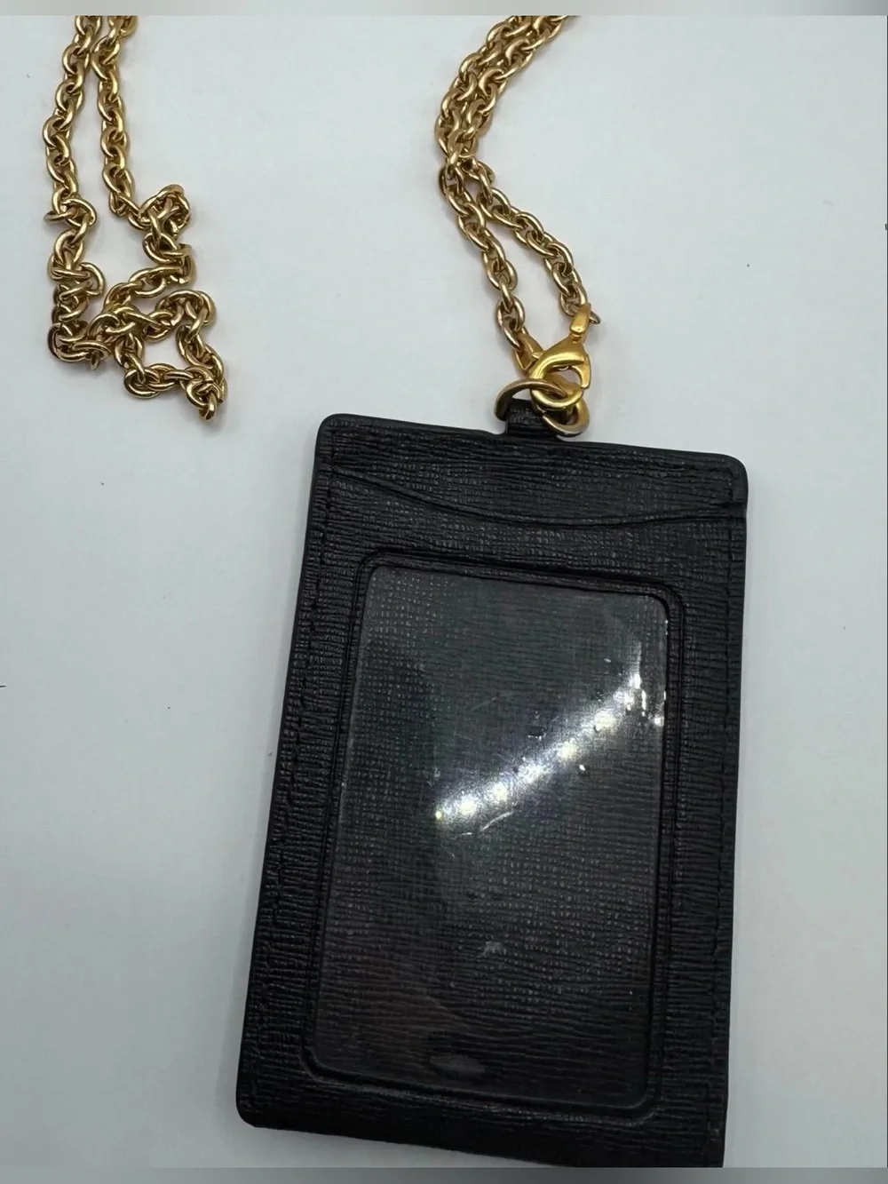 Kate Spade lanyard is holder black gold chain